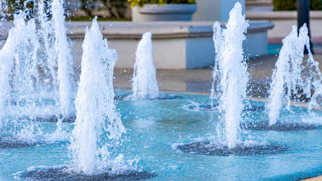 Splash pad fountains spraying on a sunny day