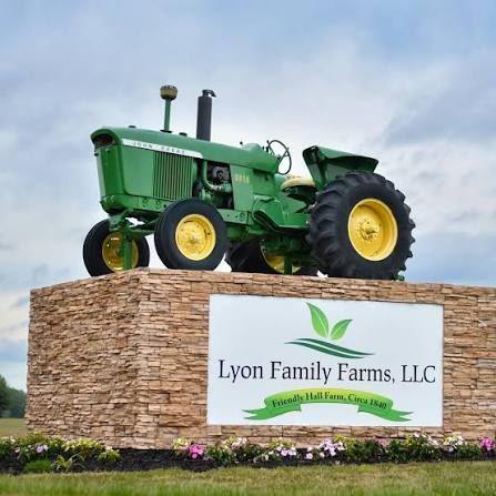 Lyon Family Farms entrance sign with tractor
