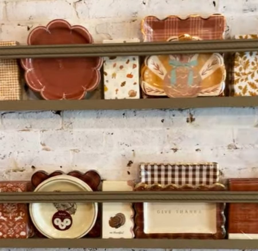 Shelves of fall paper plates and napkins at Hayloft Home